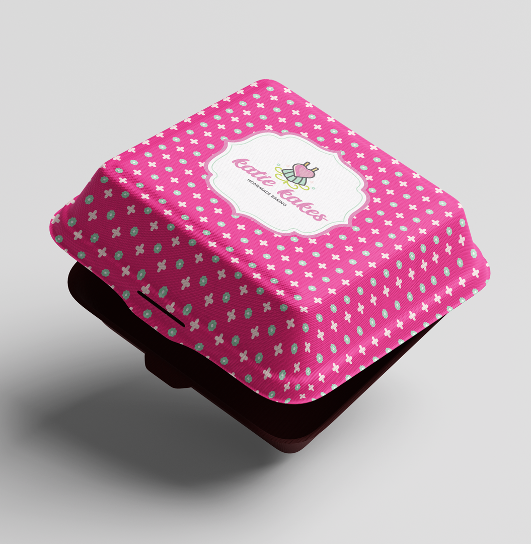 Katie Kakes branded pink takeout box with custom pattern and logo label